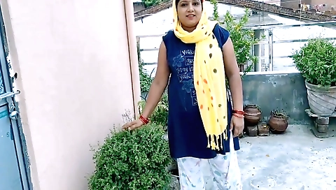 Indian girl rides a motorbike in the city outdoors