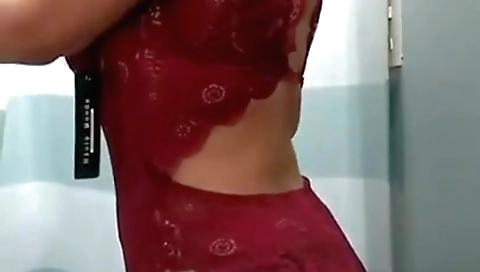 Big tits brunette babe in a small dress in the trial room