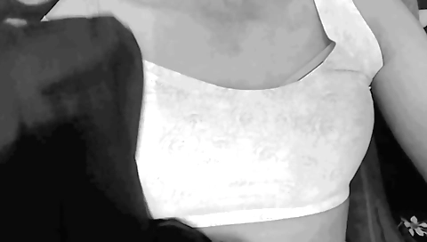 Solo female in a yellow hoodie and stockings in living room