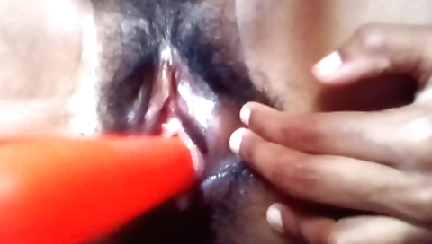 A hairy Indian housewife rides a dildo in her pussy