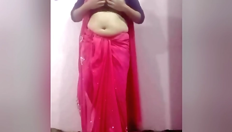 Busty brunette is showing off her body in webcam vid