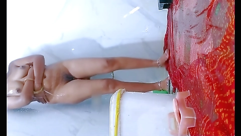 Busty brunette in the bathroom showing her hairy pussy