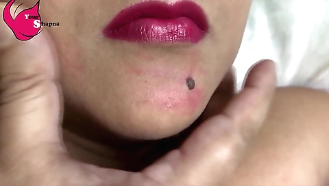 Indian girl gives him a kiss with her lips and a lollipop