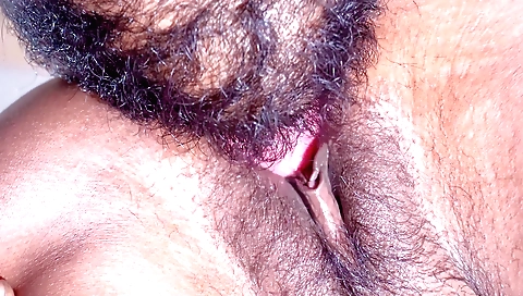 Indian girl with hairy pussy licks and touches her pussy