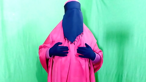 Solo female in her clothes is in bed and she is touching her pussy