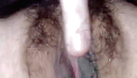 Amateur girl in stockings and boots fucks a cock with her hairy pussy